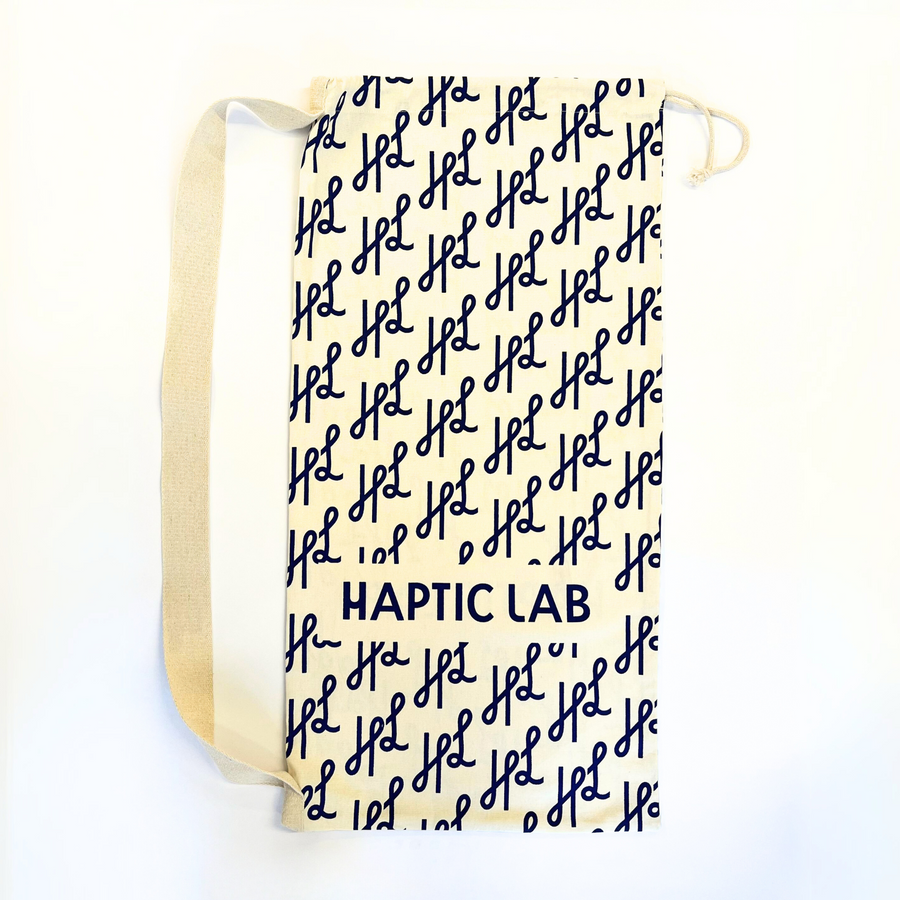 A large haptic lab gift bag with HL logo and brand name across the bag