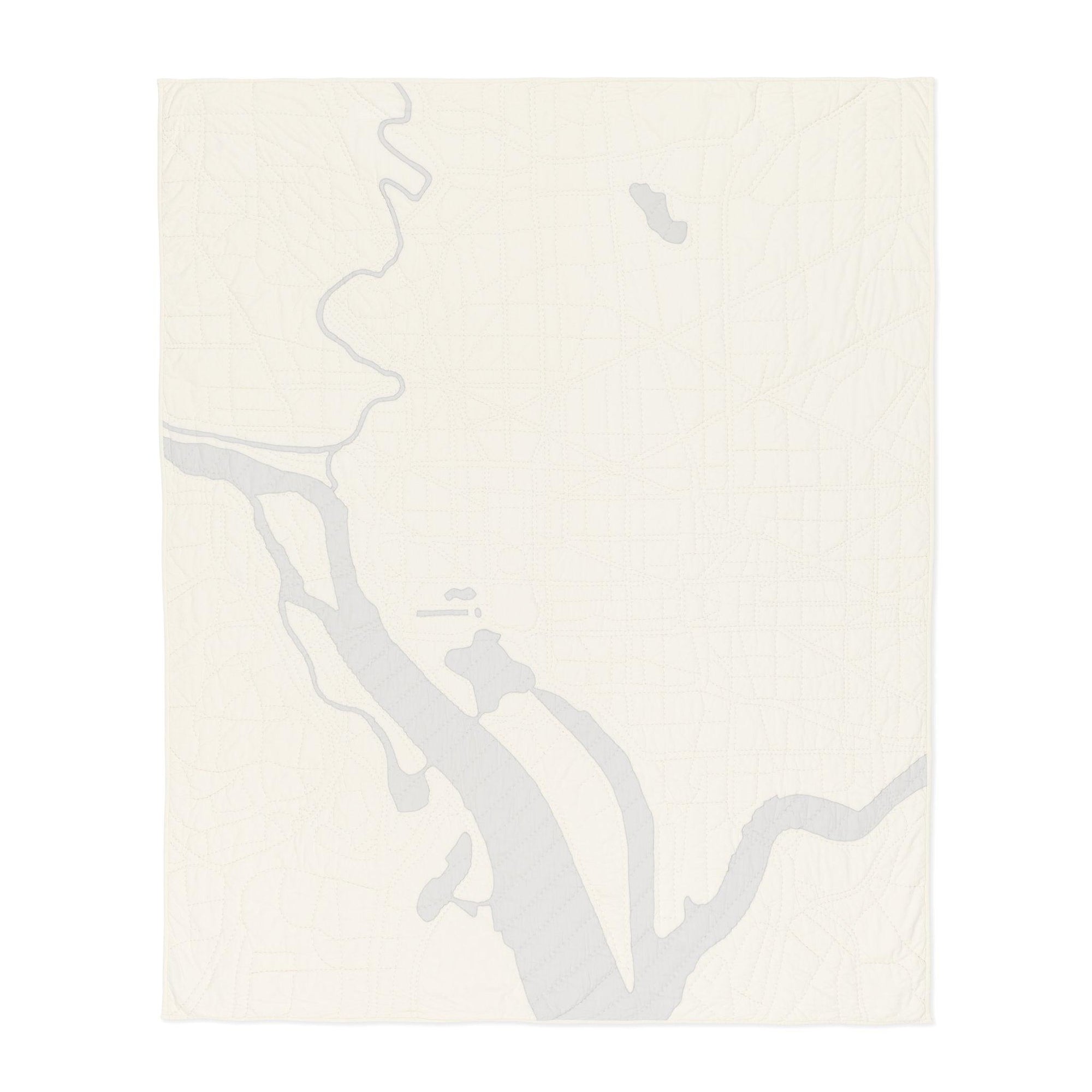 Heirloom quilt, a hand-stitched map of Washington DC with ivory land and gray water.