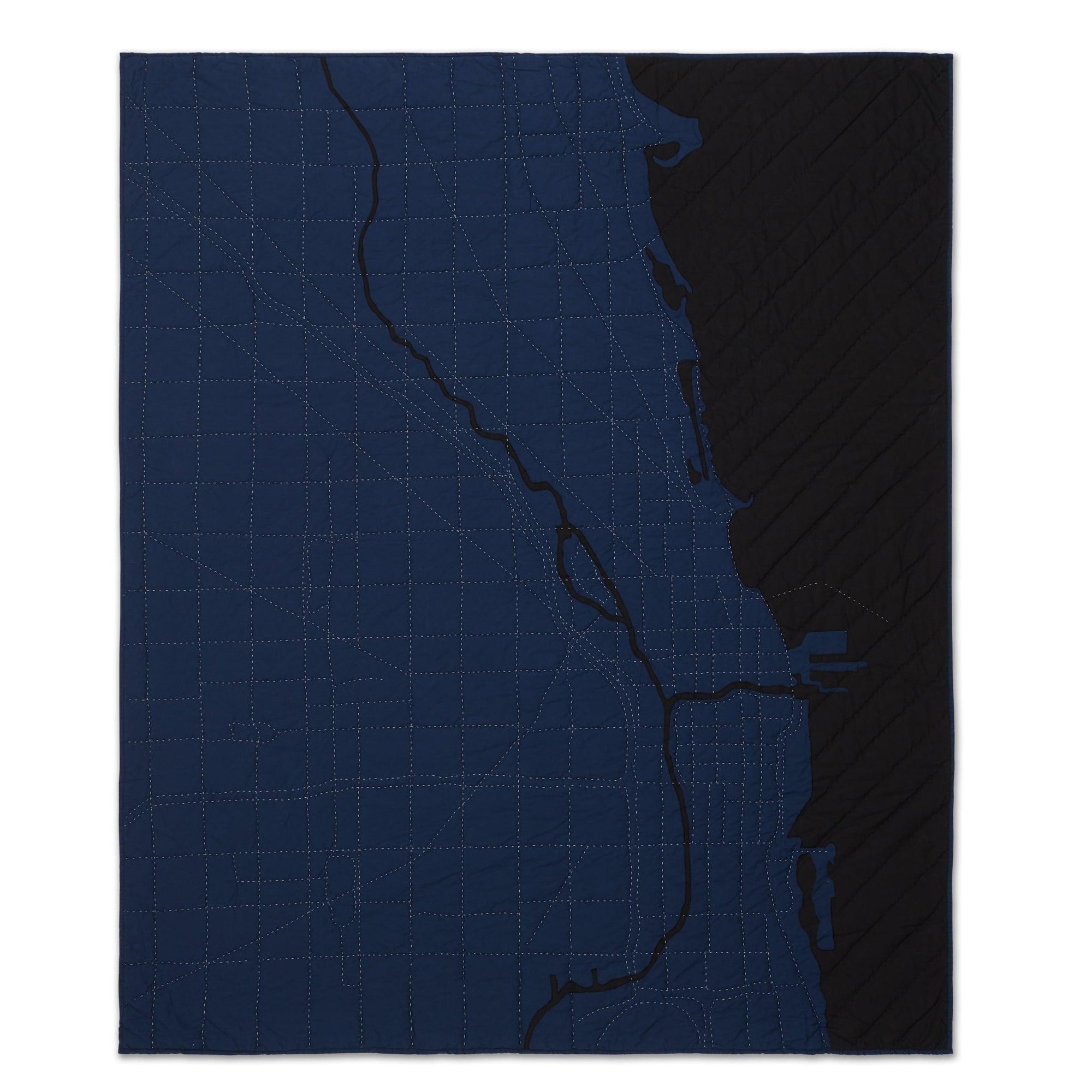 Heirloom quilt, a hand-stitched map of Chicago with dark blue land and black water.