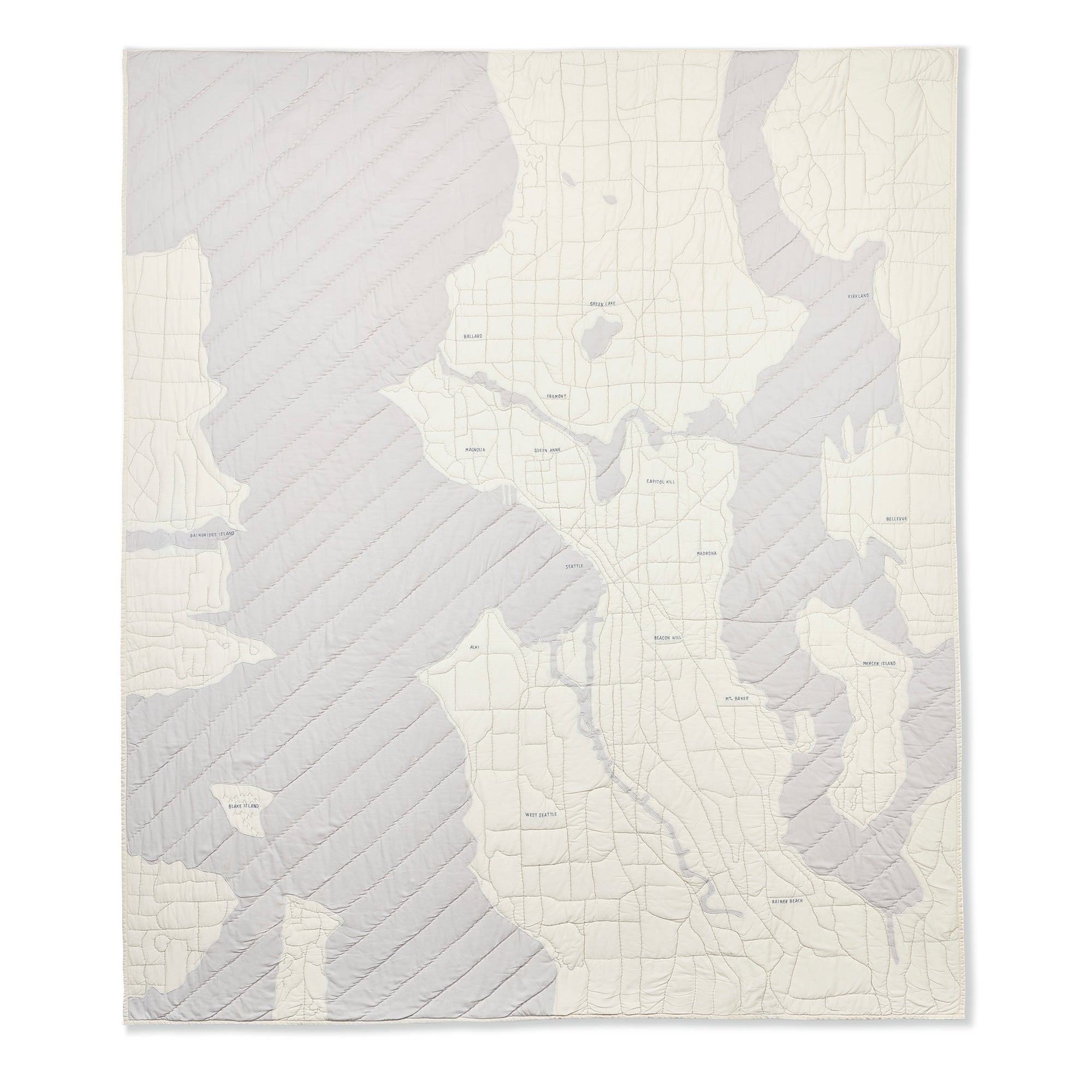Ivory and warm grey map quilt of the city of Seattle. Haptic Lab 