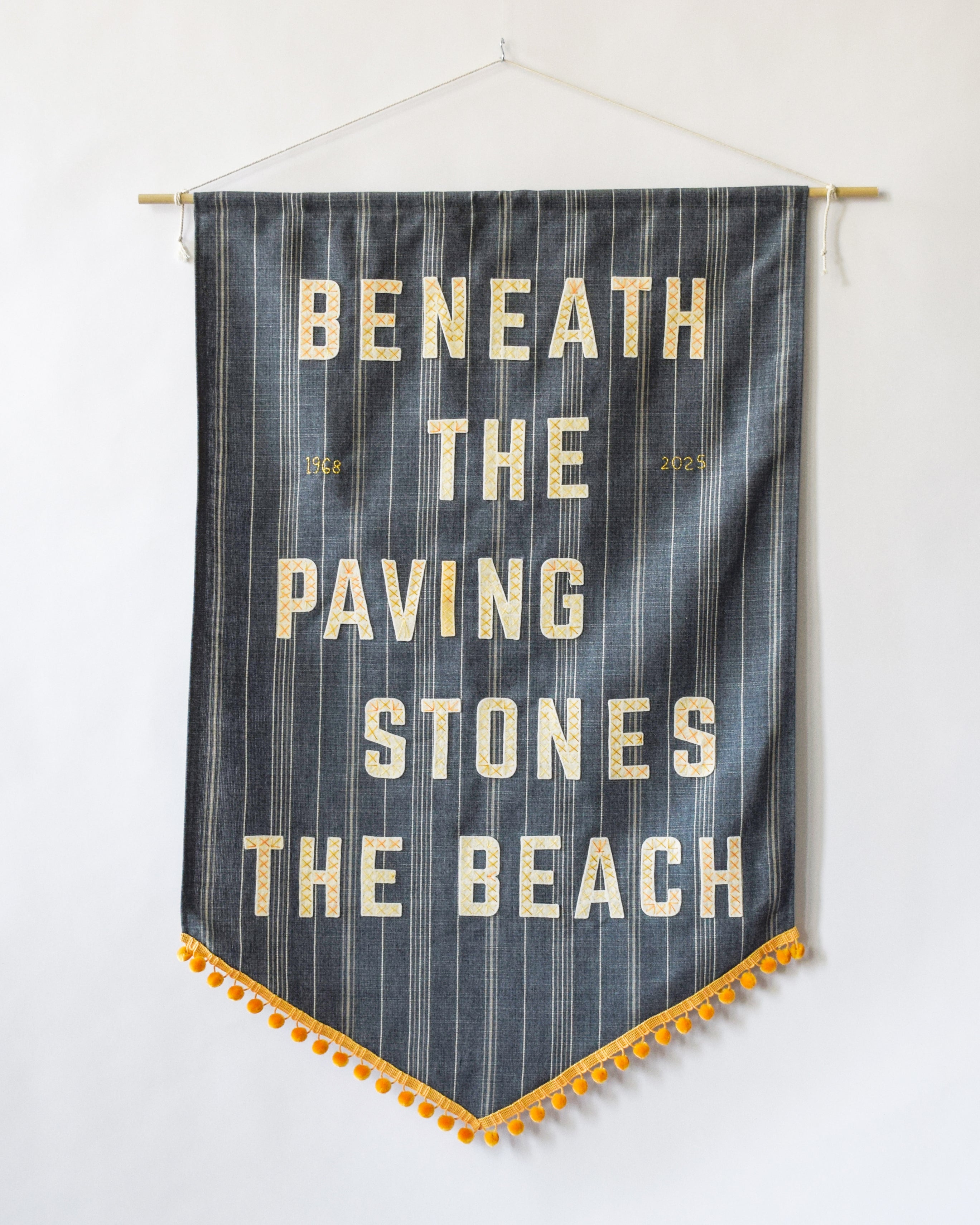 Beneath the paving stones, the beach