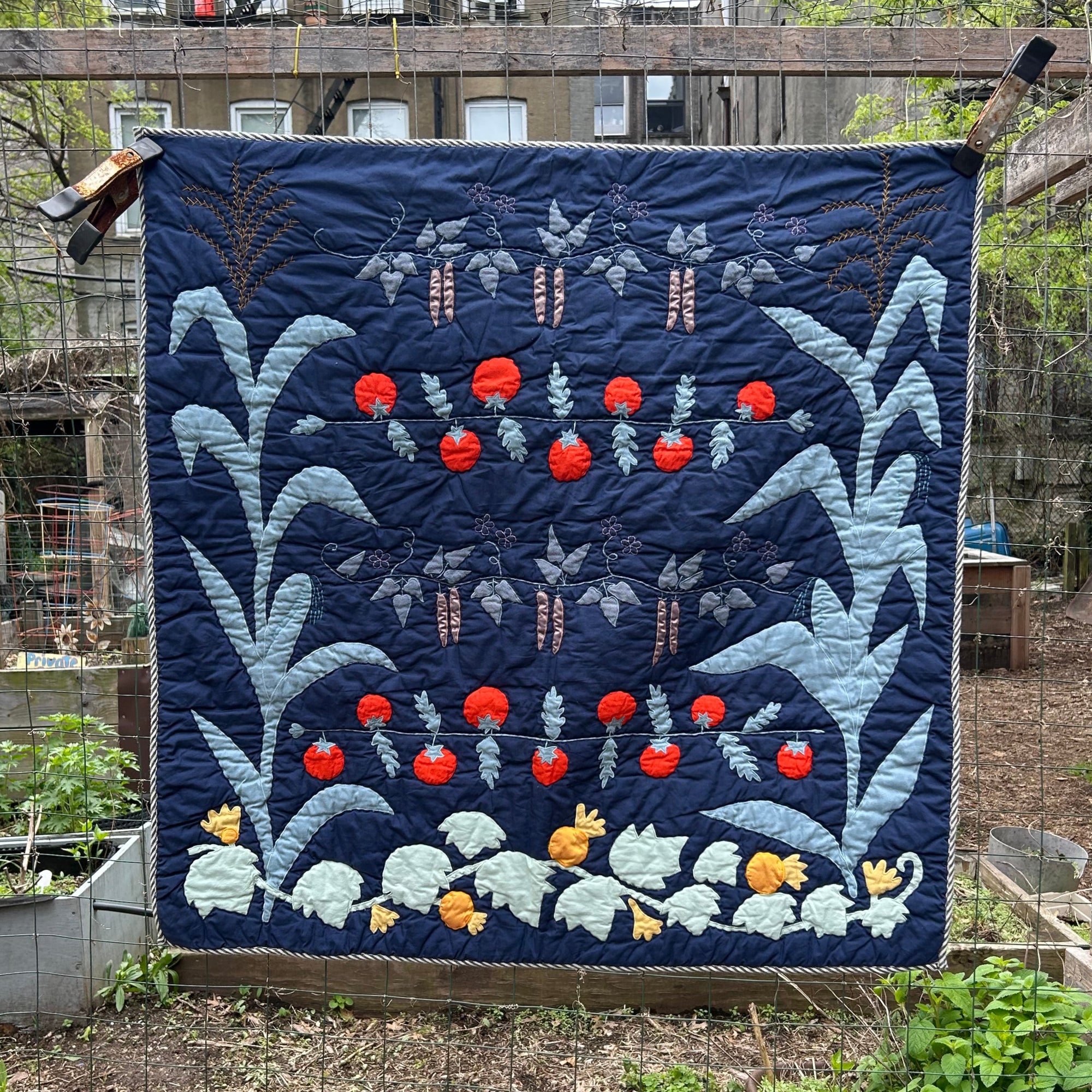 Garden Quilt hanging in the garden by Haptic Lab