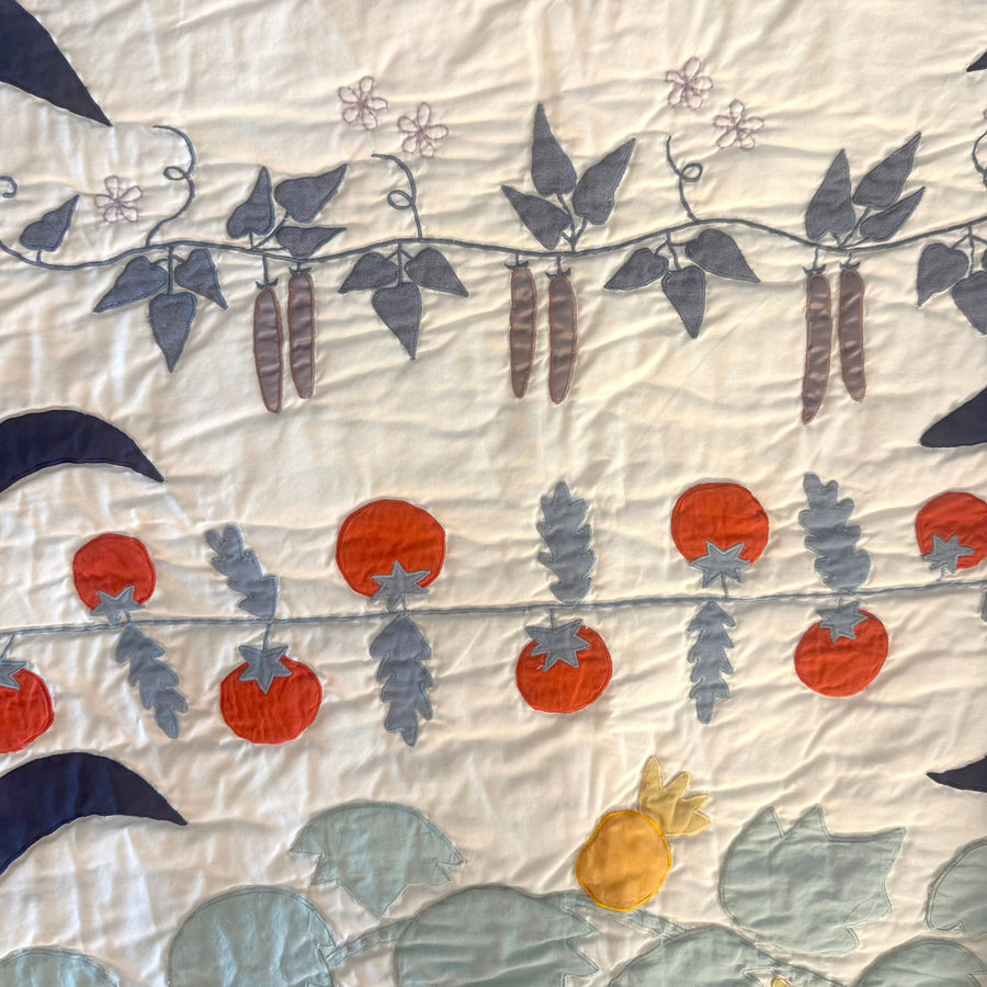 appliqued tomatoes and sweet peas on Haptic Lab's baby quilt