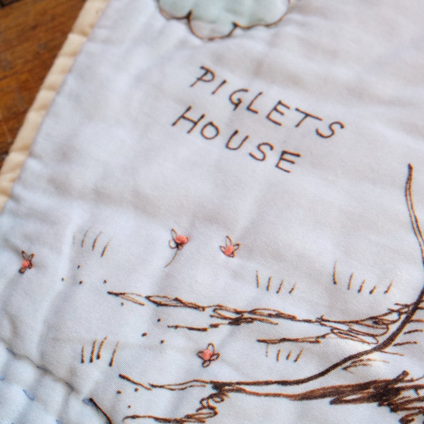 details on the Hundred Acre Wood quilt map , small french knot flowers