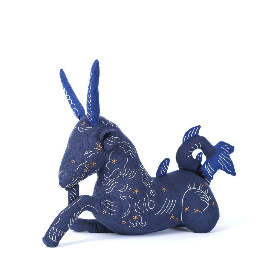 Handmade stuffed animal of zodiac sign Capricorn by Haptic Lab, handmade and embroidered with silk details.