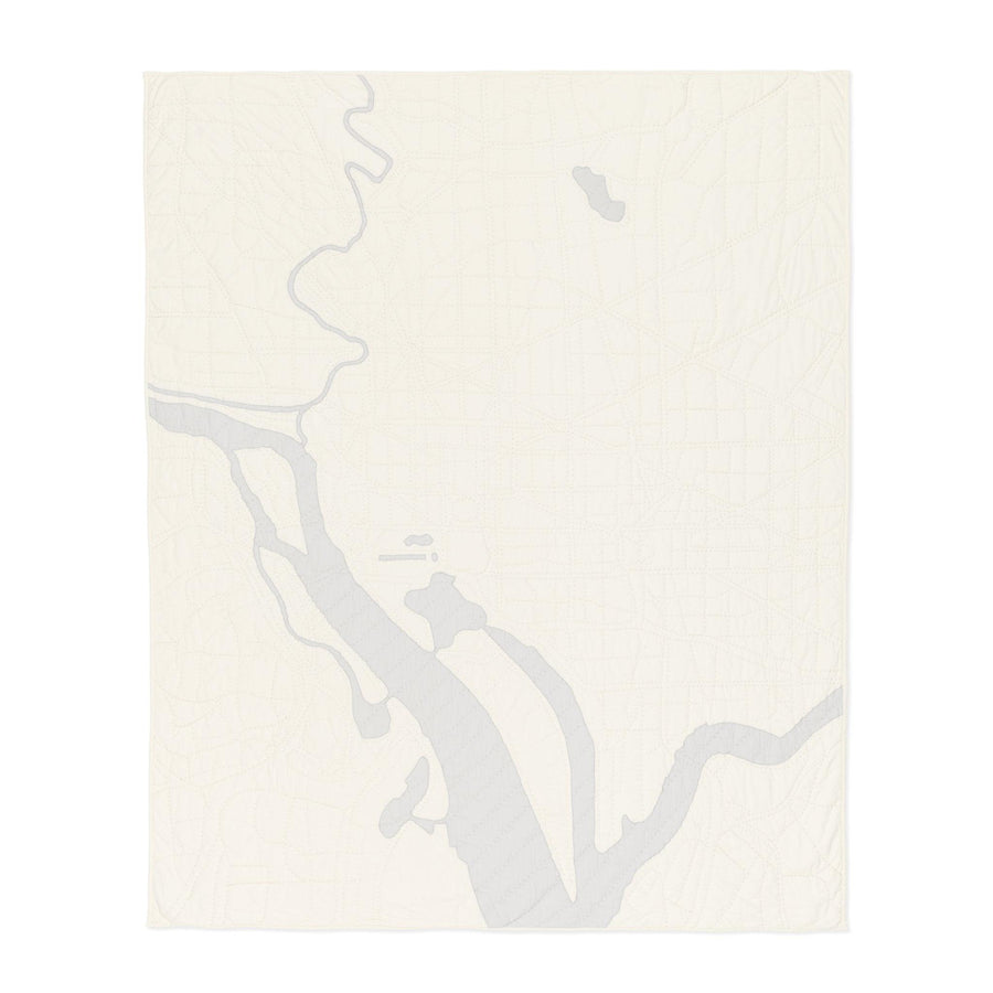 Heirloom quilt, a hand-stitched map of Washington DC with ivory land and gray water.