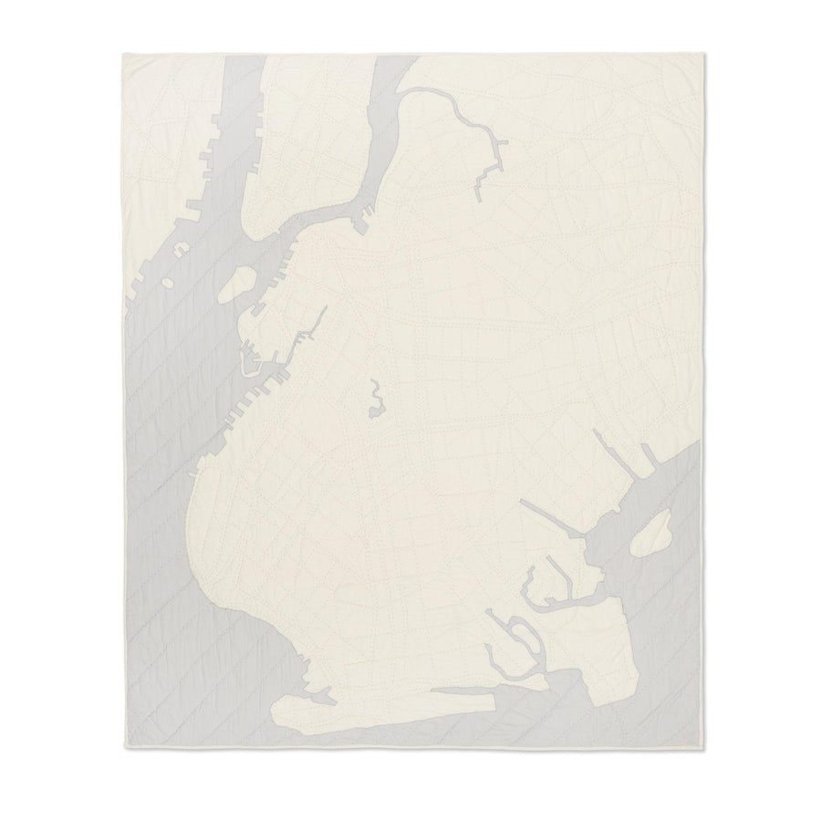 Heirloom quilt, a hand-stitched map of Brooklyn with ivory land and gray water.