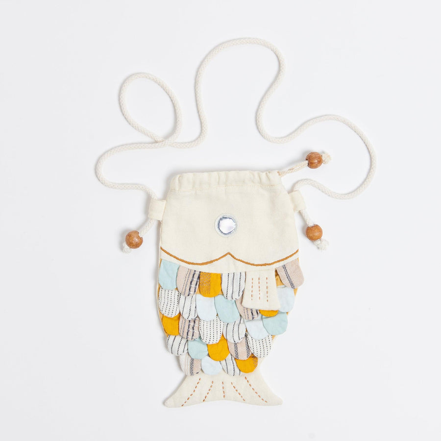 White fish purse. It has a metallic eye and the scales are made up of deadstock fabrics. 