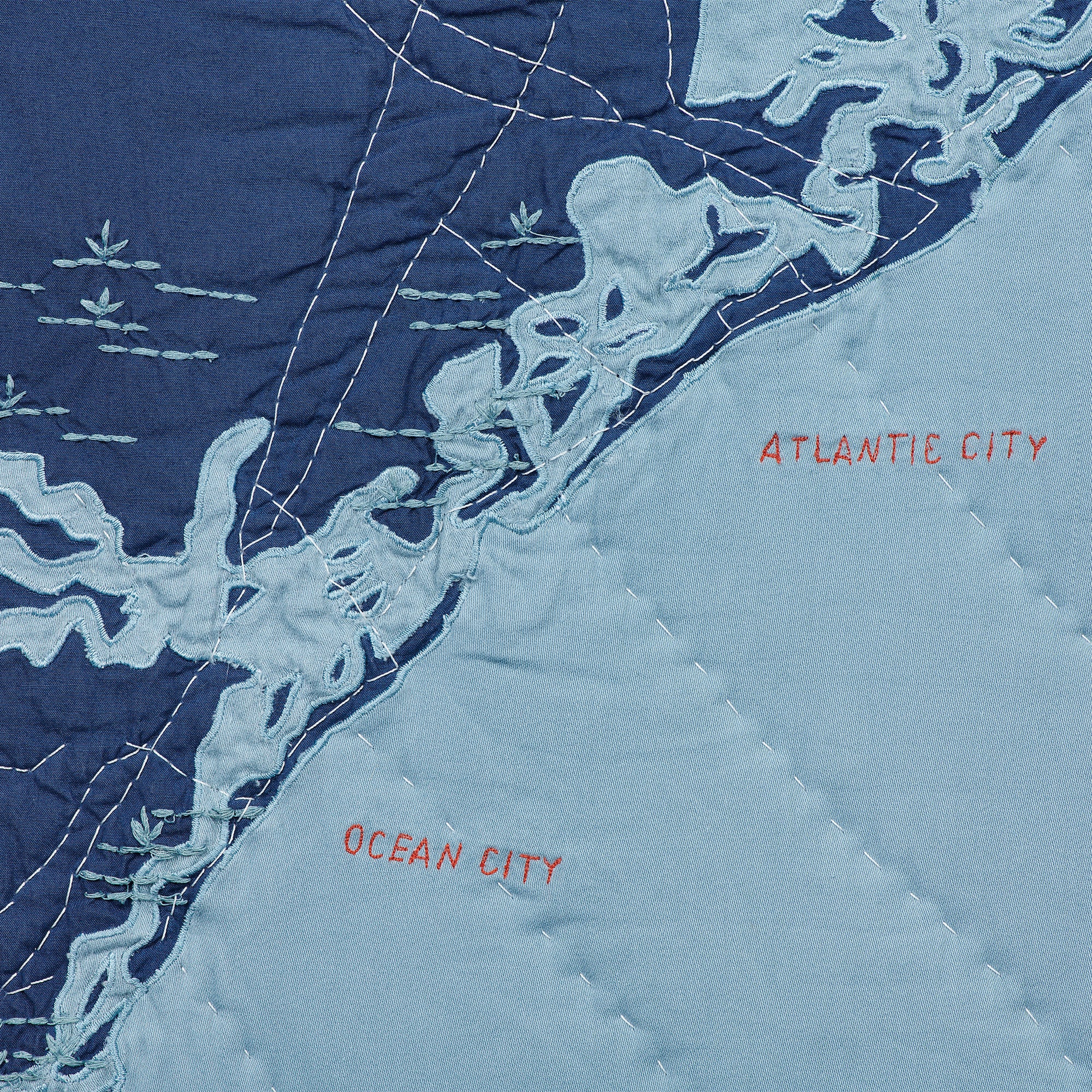 Detail shot of Atlantic City and Ocean City on the Jersey Shore Coastal Quilt in Navy and Steel blue.