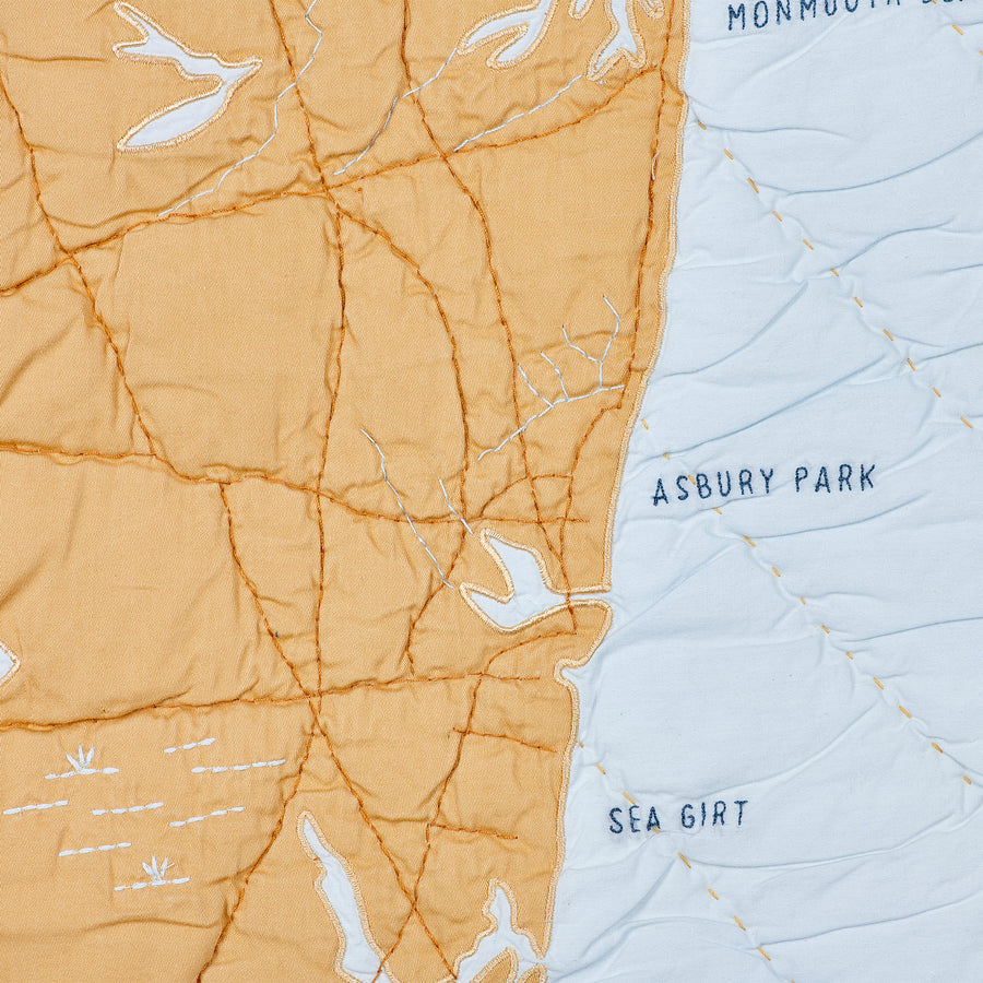 Detail Shot of the Pale blue and gold Jersey shore coastal quilt from Sea Girt to Asbury Park.