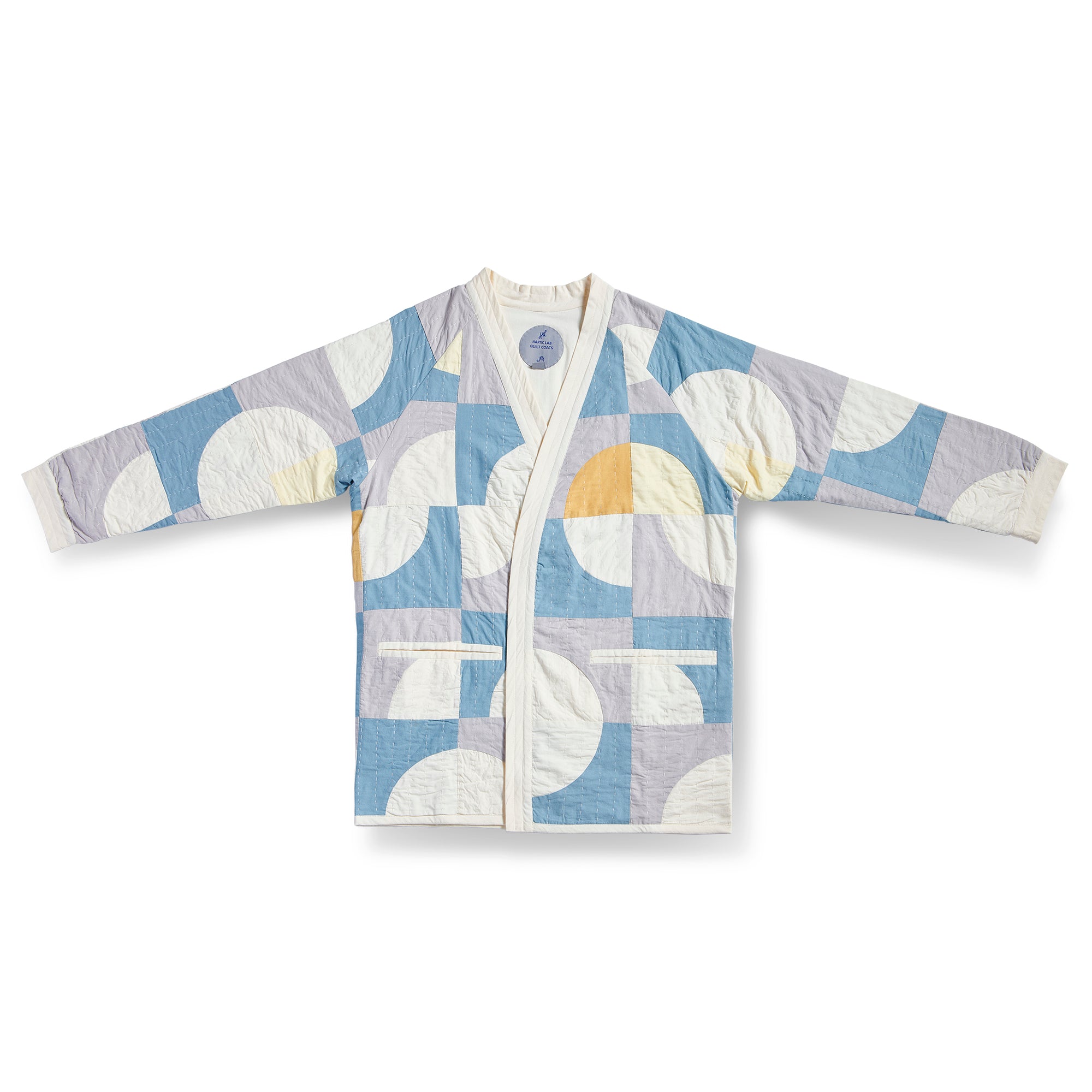 Circle in Square Spring Quilt Coat by Haptic Lab. Lightweight spring quilt coat pieced with ivory, light blue and purple cotton and hand quilted.