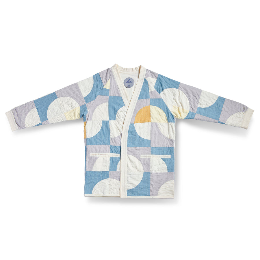 Circle in Square Spring Quilt Coat by Haptic Lab. Lightweight spring quilt coat pieced with ivory, light blue and purple cotton and hand quilted.