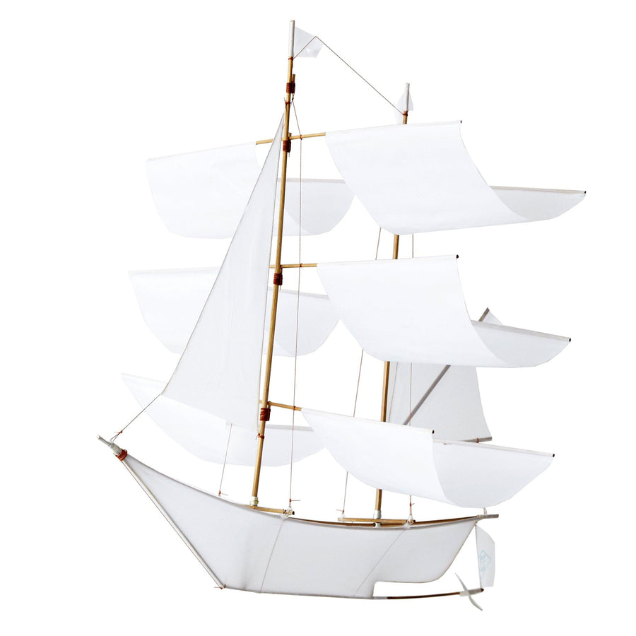 The classic white Sailing Ship Kite by Haptic Lab doubles as a baby mobile with intricate bamboo rigging.