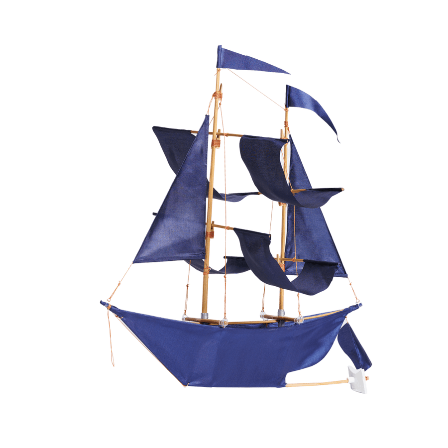 Mini sailing ship baby mobile shown with indigo sails and bamboo masts by Haptic Lab.