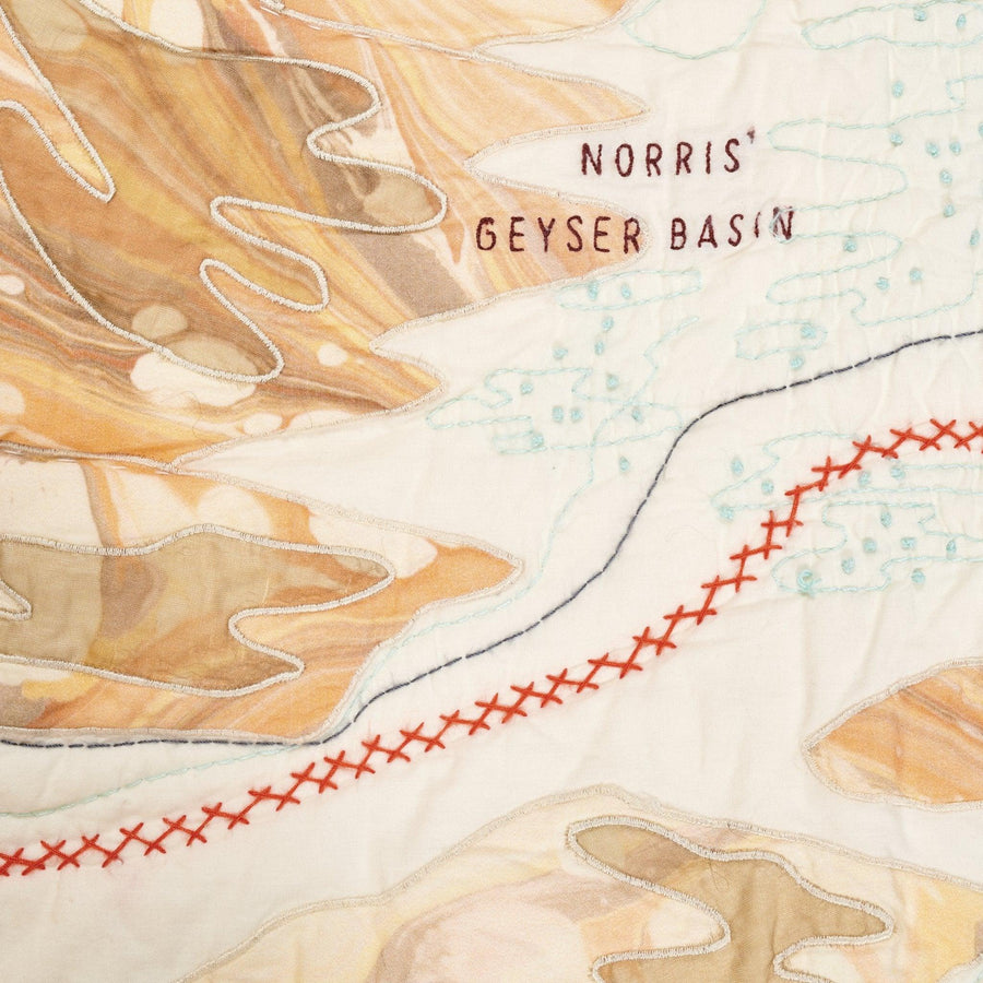 Yellowstone National Park Map Quilt detail showing embroidery around Norris Geyser Basin.